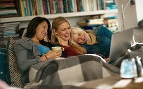 Three girls watching a movie